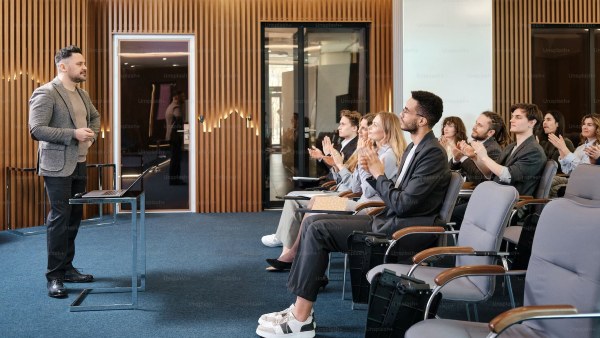 A man speaking to a group of people